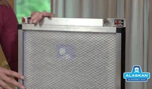 hands holding air filter
